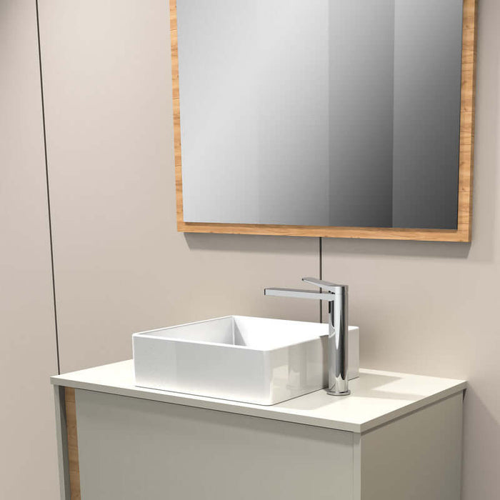 Lava sobre encimera modelo Jade en baño moderno, con grifo y espejo de madera.