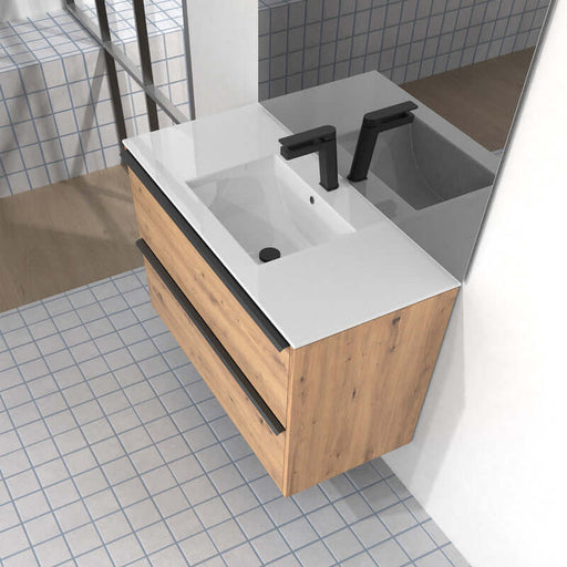 Lavabo de encastrar modelo Bogotá en un baño moderno, con acabado en blanco brillo y bancada de madera.